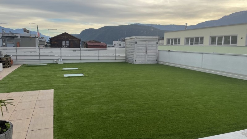 Artificial lawn on rooftop terrace in Bolzano