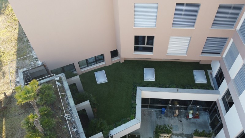 Artificial lawn on rooftop terrace Pederzoli Health Clinic Peschiera Lake Garda